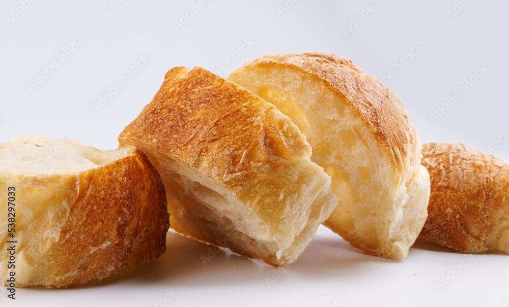Sliced baguette on a white background. Fresh baguette. Sliced baguette on a white background. Fresh baguette.