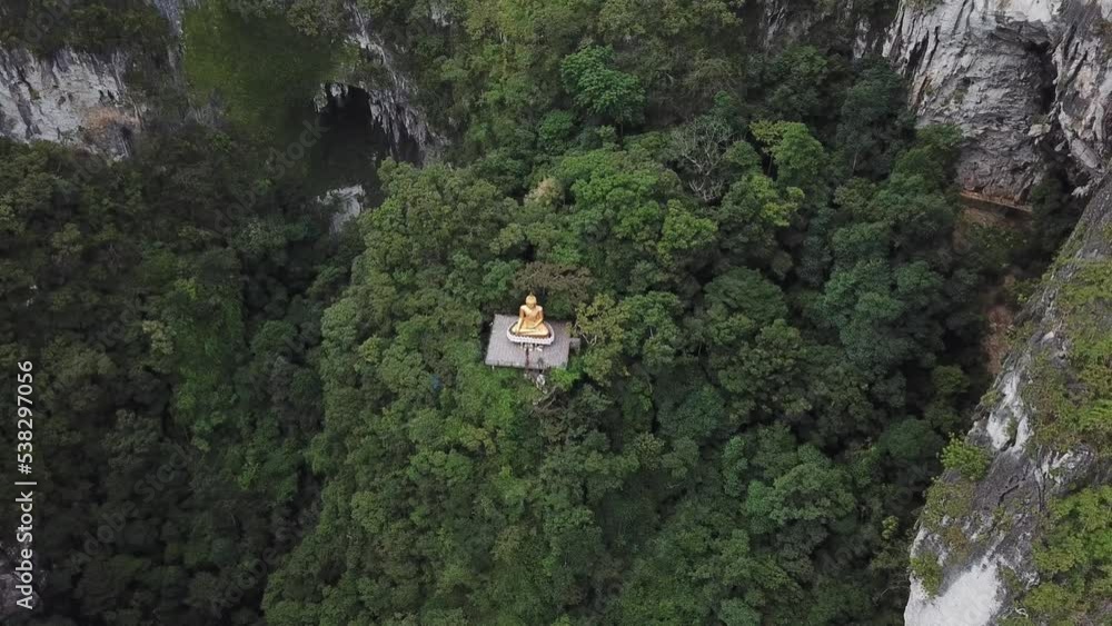The symbol of the Buddhist faith between the cliffs of the limestone mountains. The symbol of the Buddhist faith between the cliffs of the limestone mountains.