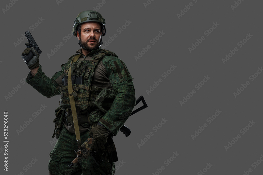 Shot of brave russian army soldier dressed in uniform and holding pistol. Shot of brave russian army soldier dressed in uniform and holding pistol.