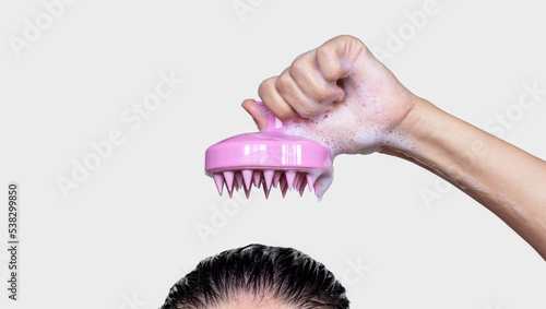 girl top of head with shampoo foam on hair using silicone brush for scalp massage hair growth stimulation mockup free space for text.woman in different poses holding brush with hand finger photo