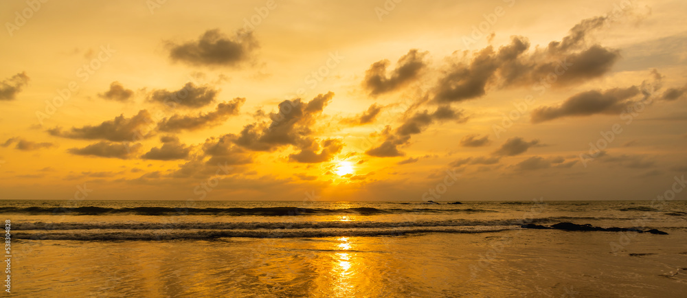 Dramatic sunset sky over the sea at Phuket Thailand. Cloudy sunset and sunrise sky at sea concept panorama image.