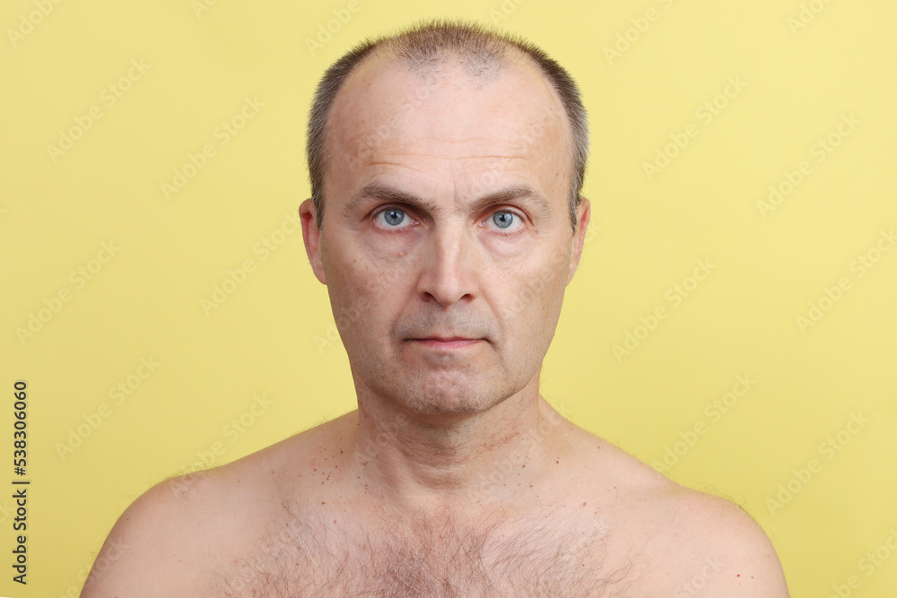 Close-up portrait of an elderly handsome man without clothes. Close-up portrait of an elderly handsome man without clothes.