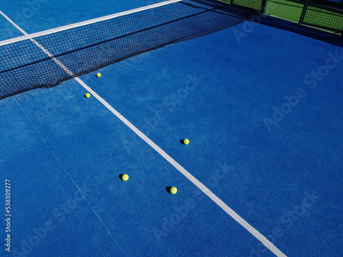 aerial view of a paddle tennis court with balls, racket sports © Vic