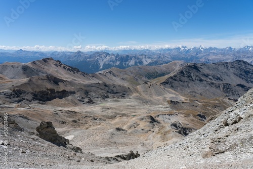 Scenic view of a mountainous landscape from Sommeiller peak between the Italian and France border photo