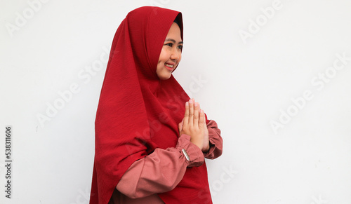 Portrait young beautiful Muslim woman wearing a hijab. Eid Mubarak greeting