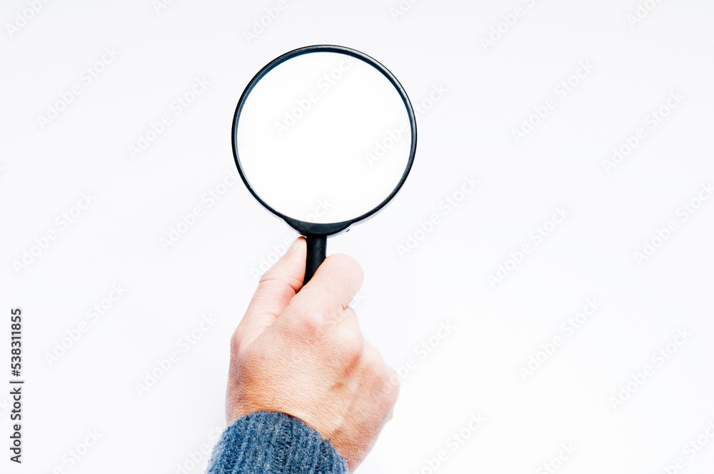 hand holding a magnifier, search concept hand holding a magnifier, search concept