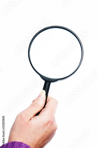 hand holding a magnifier, search concept
