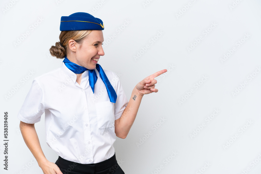 Airplane blonde stewardess woman isolated on white background pointing finger to the side and presenting a product Airplane blonde stewardess woman isolated on white background pointing finger to the side and presenting a product