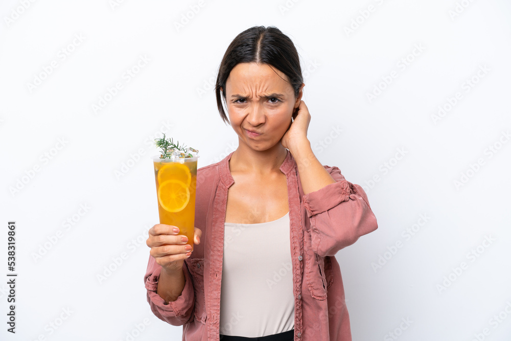 Young hispanic woman holding a cocktail isolated on white background having doubts