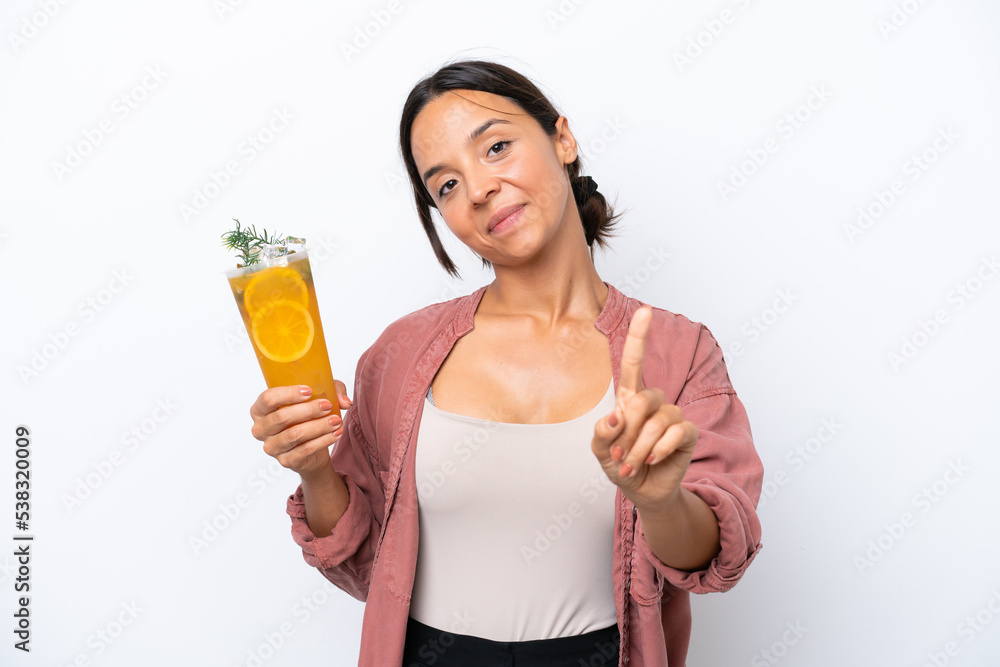 Young hispanic woman holding a cocktail isolated on white background showing and lifting a finger Young hispanic woman holding a cocktail isolated on white background showing and lifting a finger