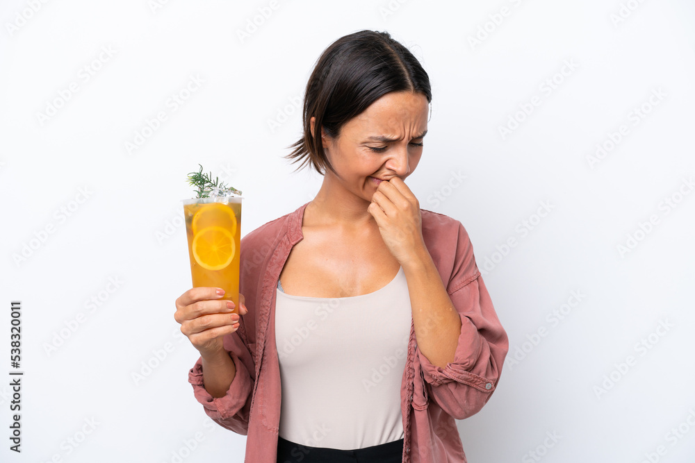Young hispanic woman holding a cocktail isolated on white background having doubts Young hispanic woman holding a cocktail isolated on white background having doubts