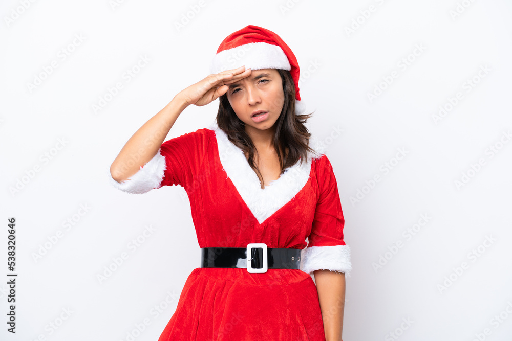 Young hispanic woman dressed as mama noel isolated on white background looking far away with hand to look something Young hispanic woman dressed as mama noel isolated on white background looking far away with hand to look something