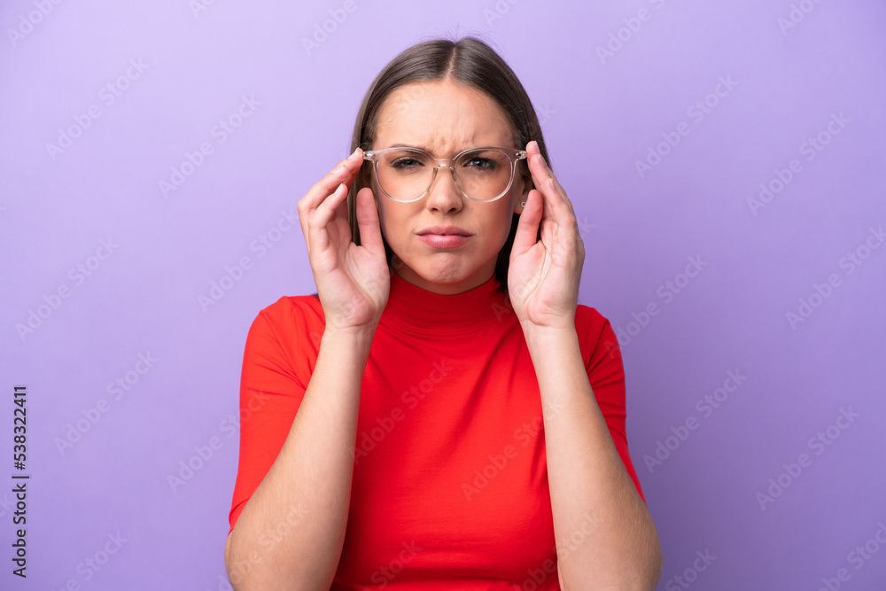 Young caucasian woman isolated on purple background With glasses and frustrated expression Young caucasian woman isolated on purple background With glasses and frustrated expression
