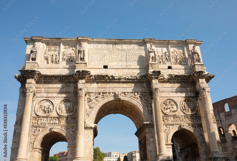 A landscape view of the Arch of Constantine in sunny holidays, lots of tousists, summer vacation, Rome, Italy.