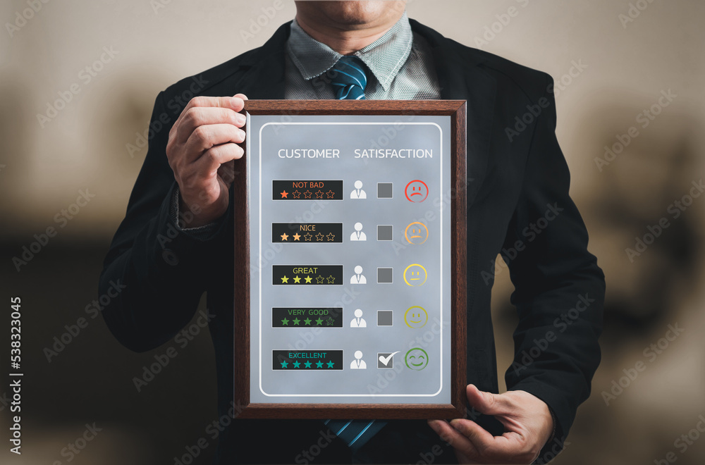 person hand hold frame give happy smile face icon and five star symbol to increase rating of product and service concept, Customer service experience and business satisfaction survey. person hand hold frame give happy smile face icon and five star symbol to increase rating of product and service concept, Customer service experience and business satisfaction survey.
