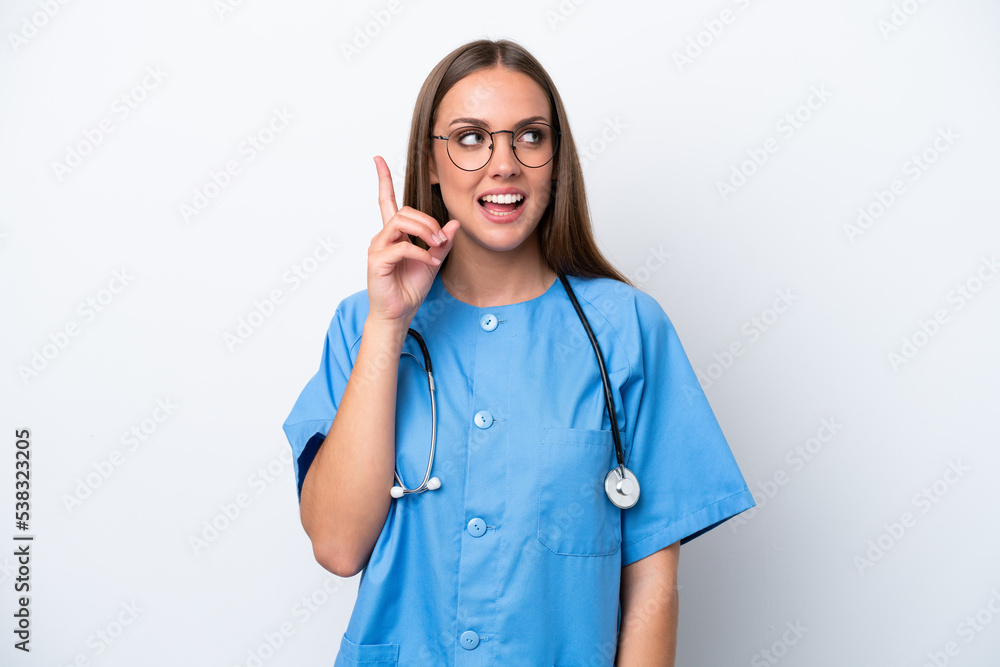 Young nurse caucasian woman isolated on white background intending to realizes the solution while lifting a finger up Young nurse caucasian woman isolated on white background intending to realizes the solution while lifting a finger up