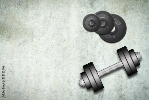 Dumbbells with discs of different weights, on a concrete background. Copy space. Place for text. Sports equipment, gym, fitness. Sports