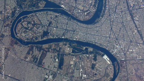 Aerial high altitude airplane view of downtown Baghdad also showing the Tigris river it is the capital of Iraq and the second largest city in the Arab world after Cairo 4k resolution animation photo