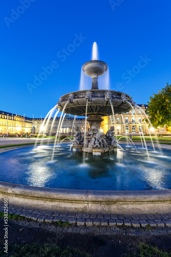 Stuttgart Castle square Schlossplatz Neues Schloss with fountain travel portrait format by night in Germany