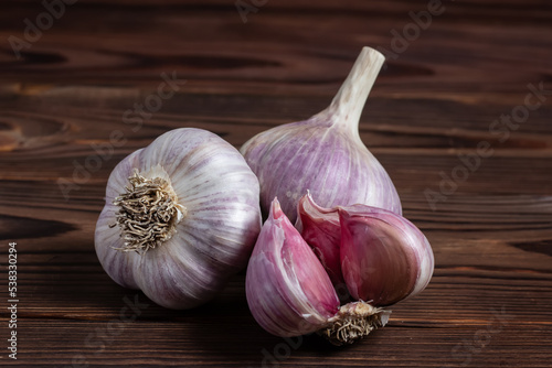 Garlic bulb on wooden background close up