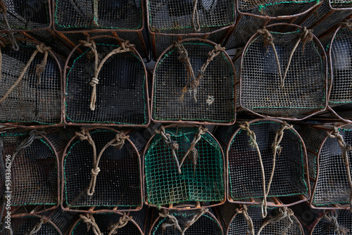 Atlantic fishing trap detail in the port waiting to be loaded onto the ship. Metal and plastic baskets to fish.
