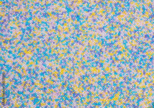  background of colorful sprinkles for sweets or beads or small balls. The concept of celebrating a birthday, party or other holidays. trendy, cute background