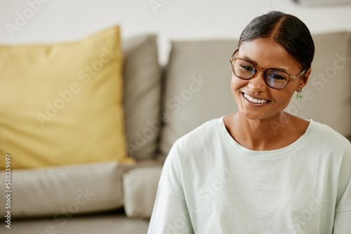 Home, living room and young Indian woman with smile on face sitting by sofa. Relax, free time and happy girl from India enjoying weekend, holiday and rest in lounge apartment and watching a movie Free Download Home, living room and young Indian woman with smile on face sitting by sofa. Relax, free time and happy girl from India enjoying weekend, holiday and rest in lounge apartment and watching a movie - GFXLoad