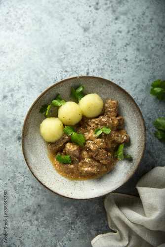 Homemade beef ragout with potato dumplings