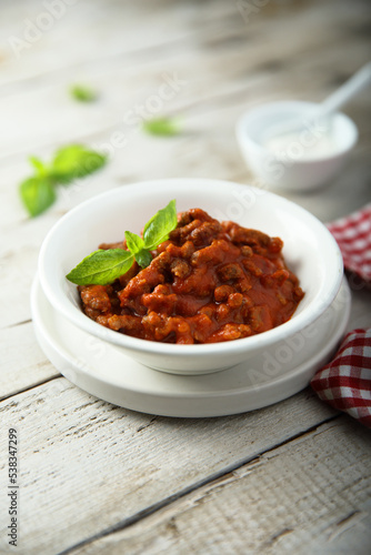 Fototapeta Naklejka Na Ścianę i Meble -  Homemade Bolognese sauce with fresh basil