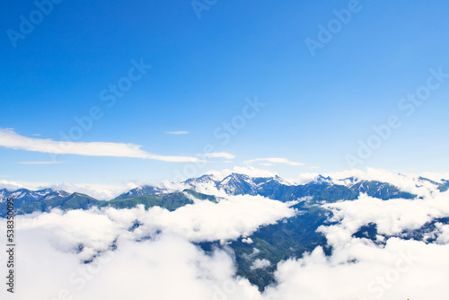 mountain peaks above the clouds © yta