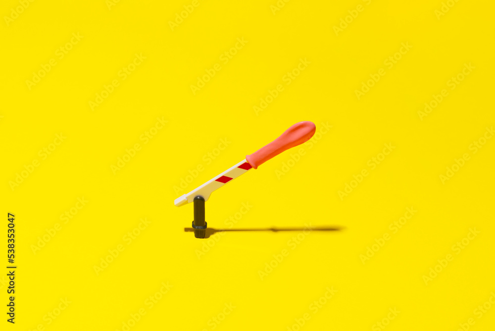 safe sex concept, figuration of penis with condom, background yellow. safe sex concept, figuration of penis with condom, background yellow.