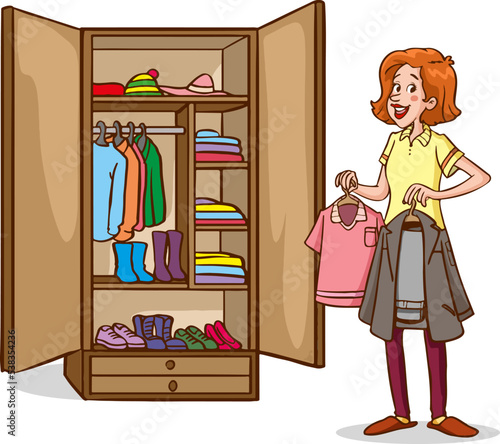 Young, pretty woman hanging dresses in wardrobe in bedroom at home