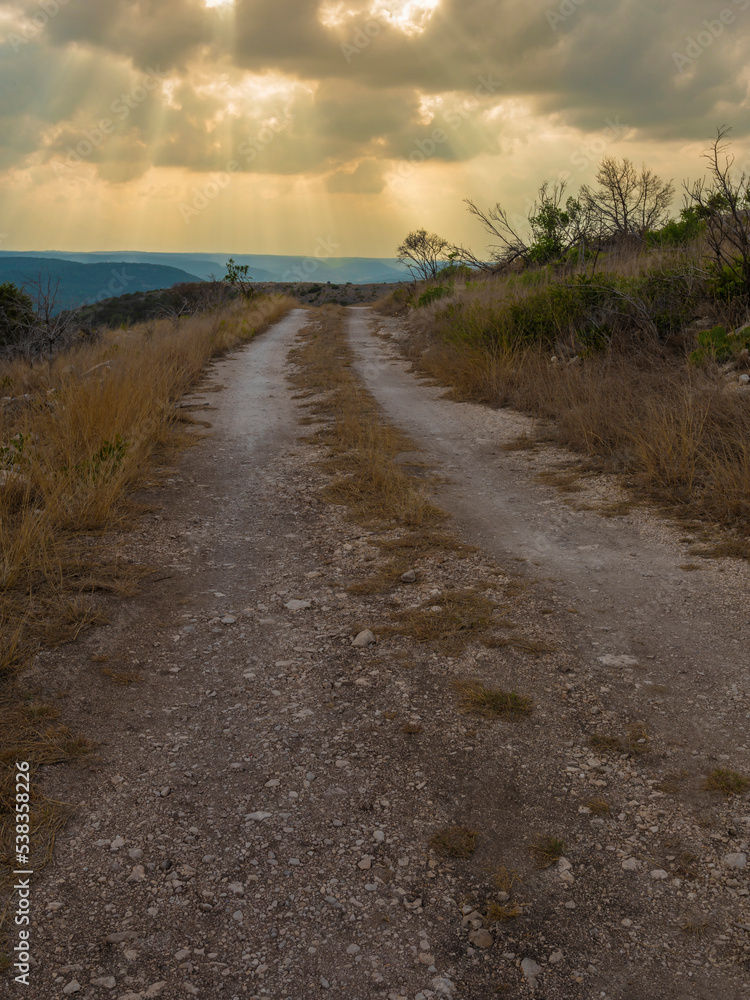 Gravel road in Texas Hill Country about to get wet Gravel road in Texas Hill Country about to get wet