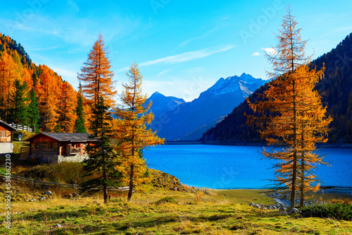 Autumn lake Alps hut mountains