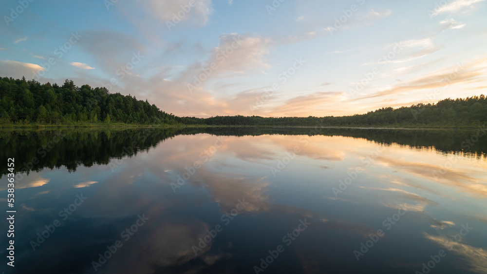 float over the lake and are reflected in the water. float over the lake and are reflected in the water.