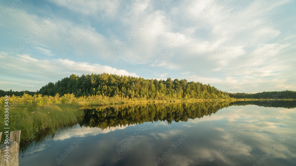float over the lake and are reflected in the water. float over the lake and are reflected in the water.