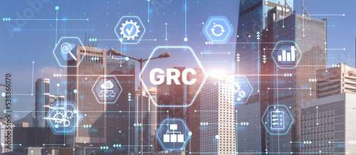 GRC Governance Risk and Compliance concept on city background photo