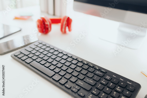 Computer notebook headset and stationary on working desk at home office