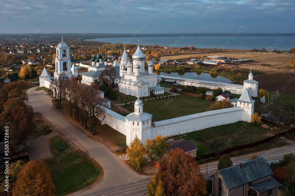 Russian Orthodox monastery behind white walls in small town near lake, Pereslavl-Zalessky, Russia