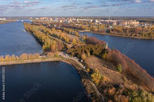 Panoramic aerial view of the city on the banks of the Volga with a dam of water power house in the foreground, Dubna, Russia
