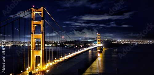 Closeup of the Golden Gate Bridge at night in San Francisco, USA