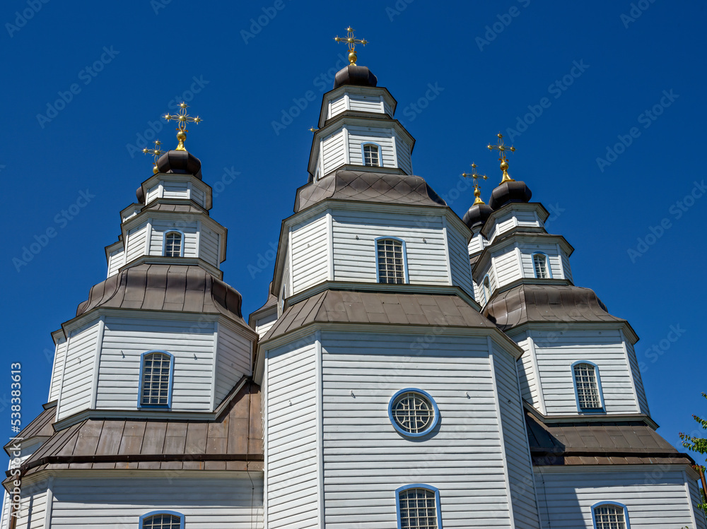 Unique wooden St. Trinity Cathedral in Novomoskovsk town, Ukraine.