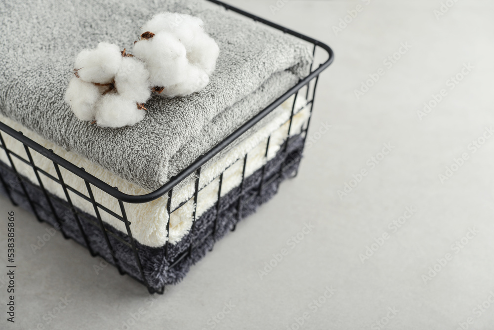towels with cotton flowers in black metal basket towels with cotton flowers in black metal basket