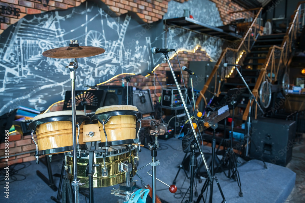 drum kit with microphone and electric instruments in restaurant