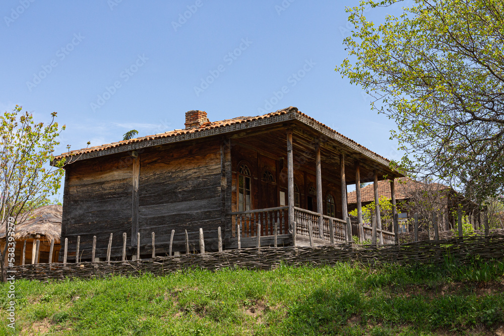 Traditional Georgian historic wooden house on top of the hill Traditional Georgian historic wooden house on top of the hill