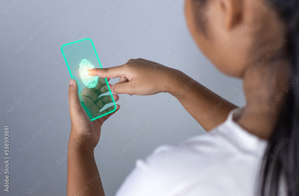 People's fingers are pressing on the phone screen. Represents protection against external hacks, code protection security concepts, viruses, firmware and malware. People's fingers are pressing on the phone screen. Represents protection against external hacks, code protection security concepts, viruses, firmware and malware.