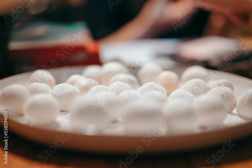 Closeup of fluffy candy balls on a plate
