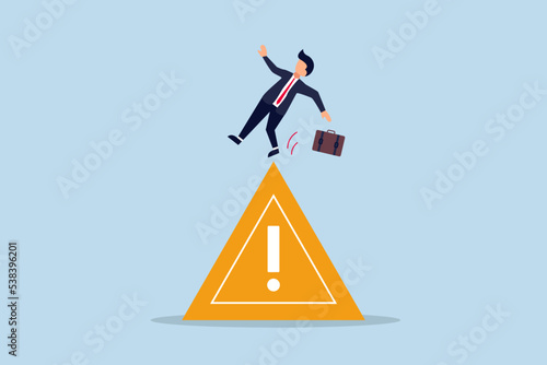 Mistake caution, business risk or problem warning, cautious businessman slip falling on exclamation symbol beware, careful caution sign.