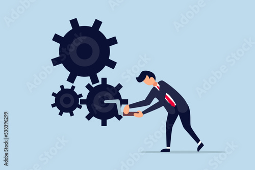 Business work flow, leadership to drive team and initiate productivity. smart businessman manager use all his power and skill to rotate group of cogwheels gear.