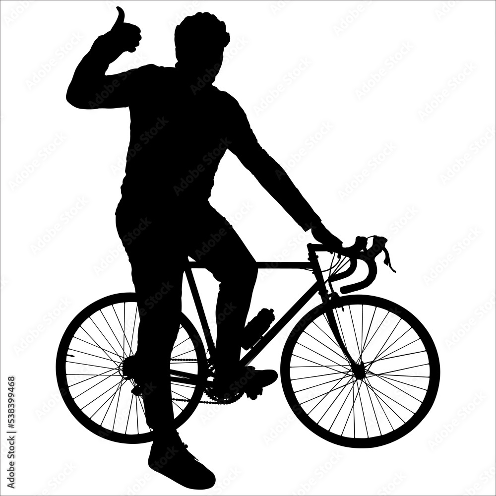 Fototapeta premium A young guy in a tracksuit, and a protective helmet, stand with one foot on the pedals of a bicycle, and the other foot is on the ground. Bicycling. Man shows the gesture 